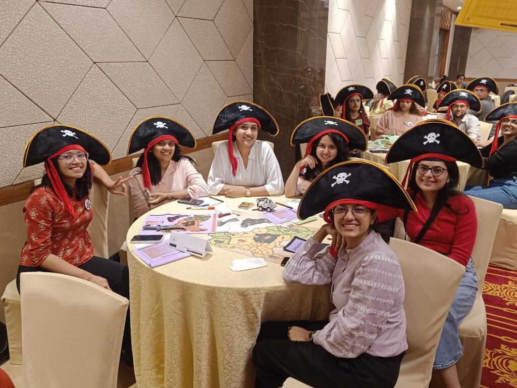Women playing in best leadership offsite business simulation