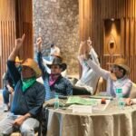 people enjoying business simulation conducted by simurise