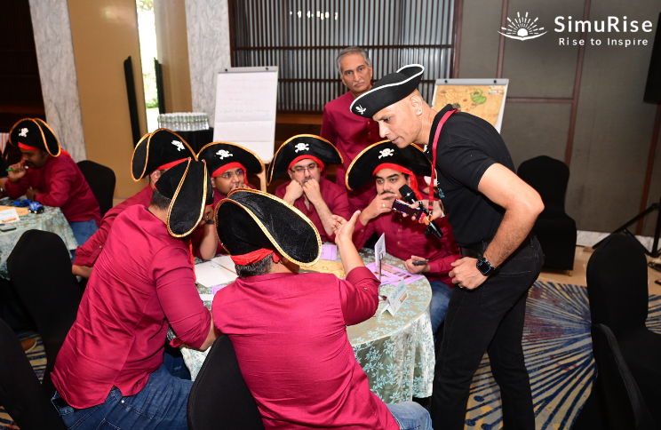 Solomon Salvis helping teams of top corporate companies in business simulations